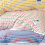 Oikos terry striped pillow cover texture and white piping close view