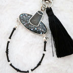 Sodamye Najeon Gat keyring with black tassel on white fur